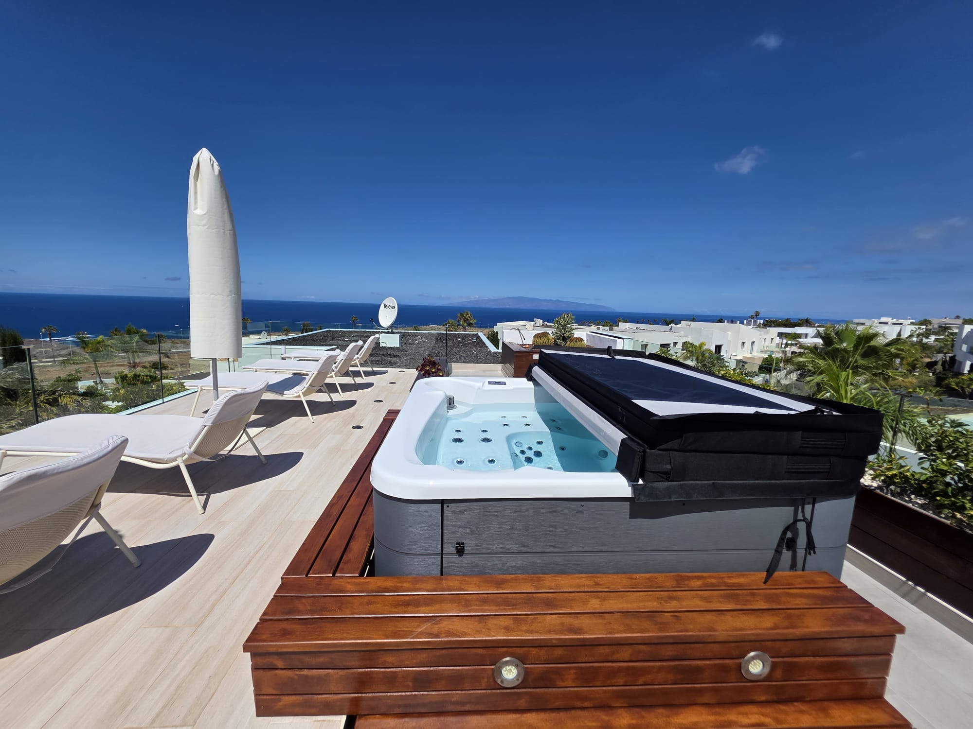Completed rooftop terrace with spa deck and glass balustrade